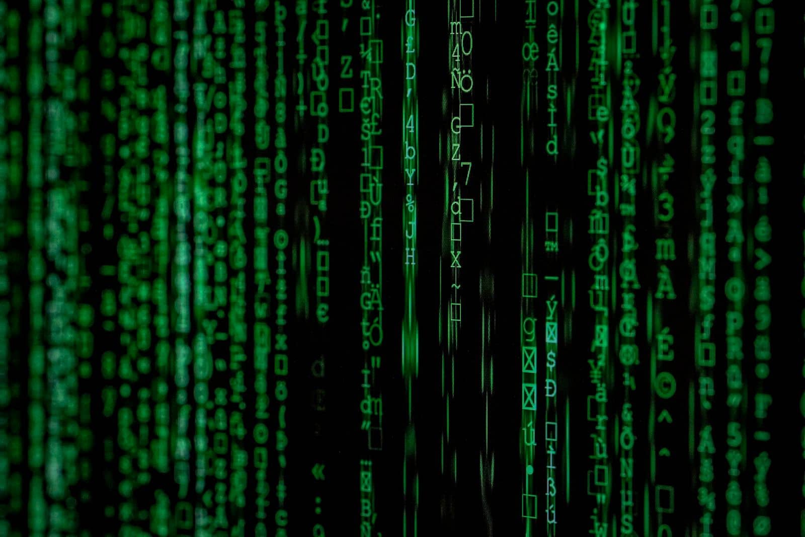 Green cascading digital code on a dark background